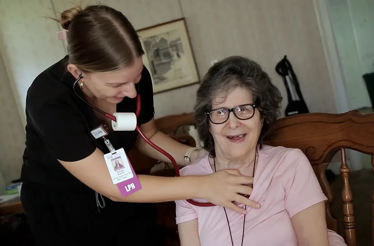 VNA employee listening to patient's heart
